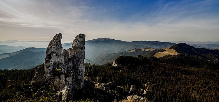 View of the amazing landscape of Romania, complete with mountains and rolling hills covered in trees