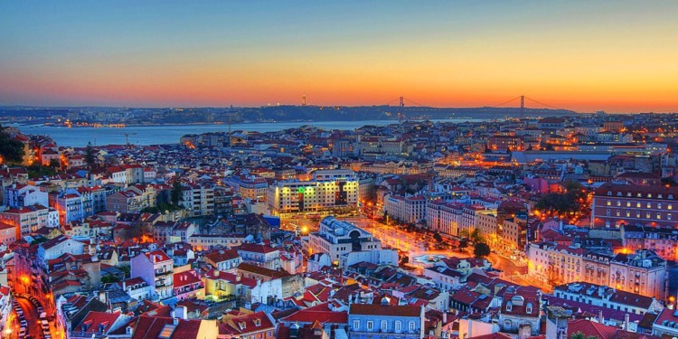 aerial view of rooftops, buildings and bridge in Lisbon Portugal