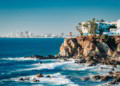 Mazatlan as seen from afar with a spectacular cliff line in the foreground