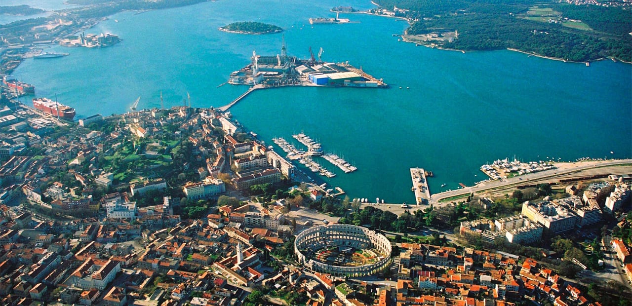 aerial view of buildings and water in Pula Croatia