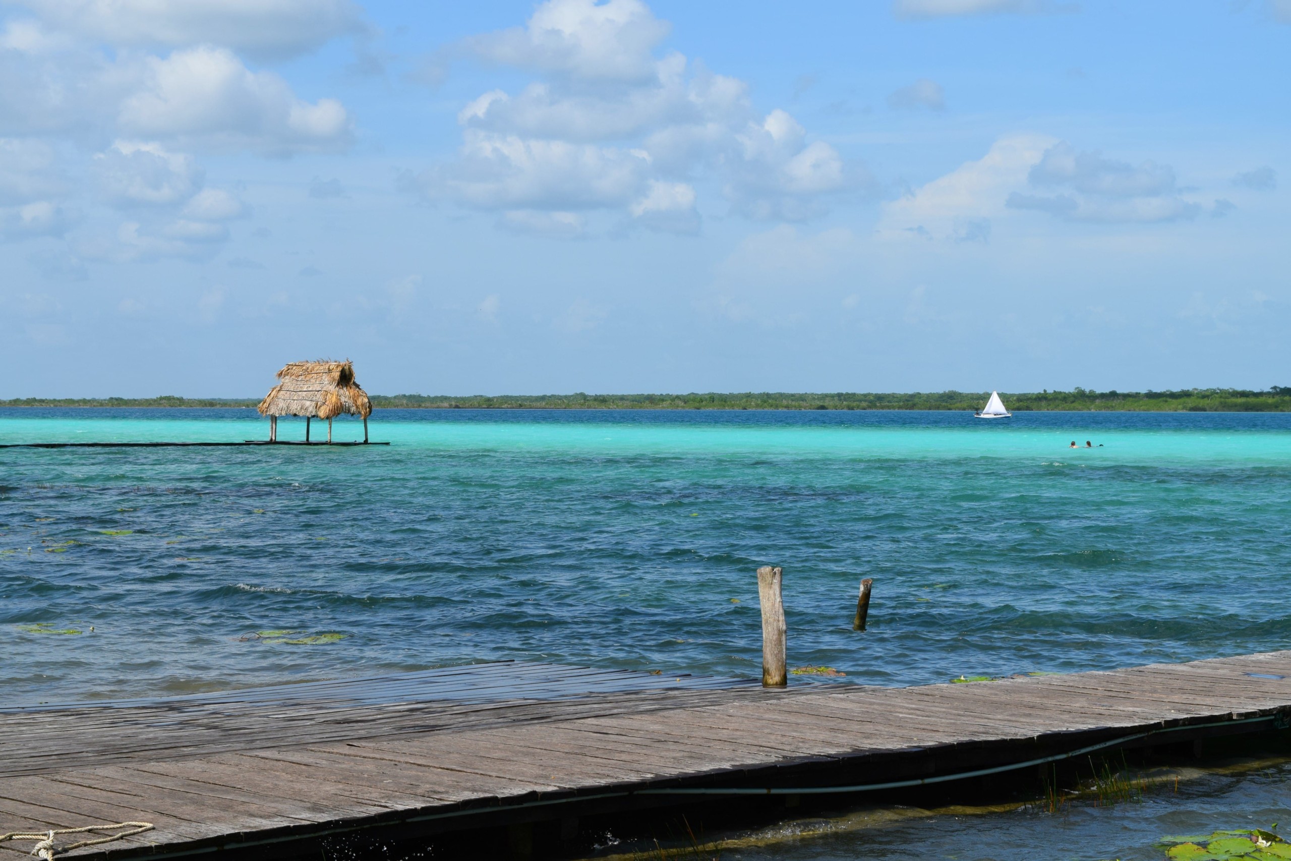 a dock in Caribbean waters. The Lagoon of Seven Colors, Bacalar, Mexico