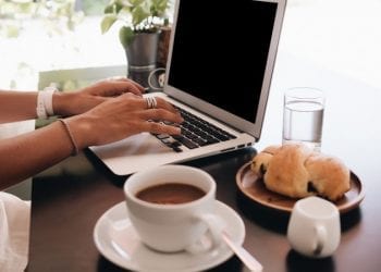 digital nomad working in medellin at breakfast time. Digital nomad is a great business opportunity abroad