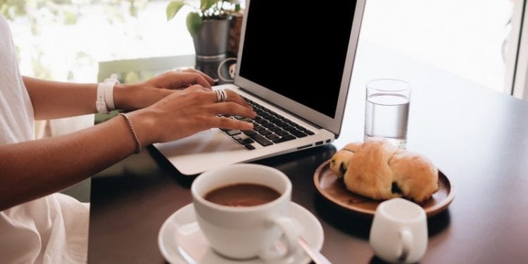 digital nomad working in medellin at breakfast time. Digital nomad is a great business opportunity abroad