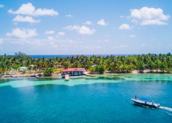 Aerial Drone view of South Water Caye tropical island in Belize barrier reef.