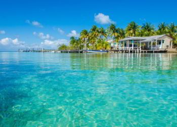 Small tropical island at Barrier Reef with paradise beach in Belize