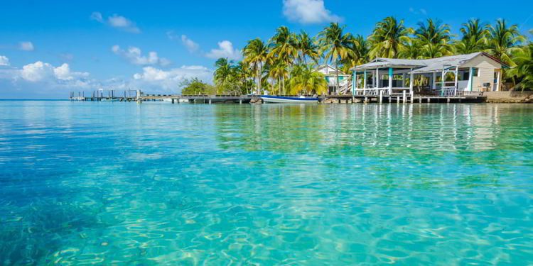 Small tropical island at Barrier Reef with paradise beach in Belize