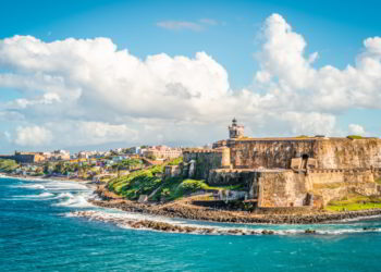 Panoramic landscape of historical castle El Morro along the coastline, San Juan, Puerto Rico. cheapest places to live in the Caribbean