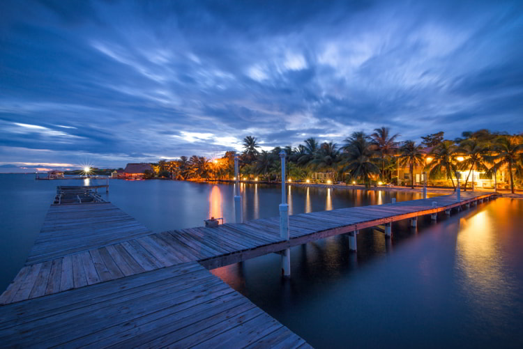 Boardwalk in Placencia, Belize at night. real estate in belize