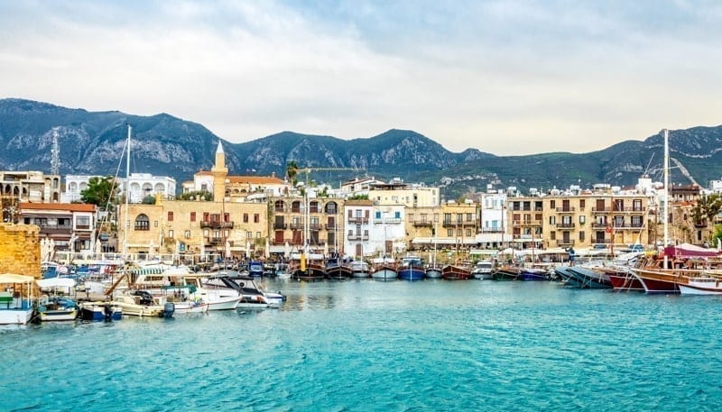 Kirenia historical city center, view to marina with many yachts and boats and mountains in the background, North Cyprus.