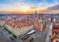 Aerial view of Rynek square, Poland with historic gothic Town Hall on sunrise.