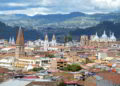 View of the city of Cuenca, Ecuador, with its many churches and rooftops, on a cloudy day