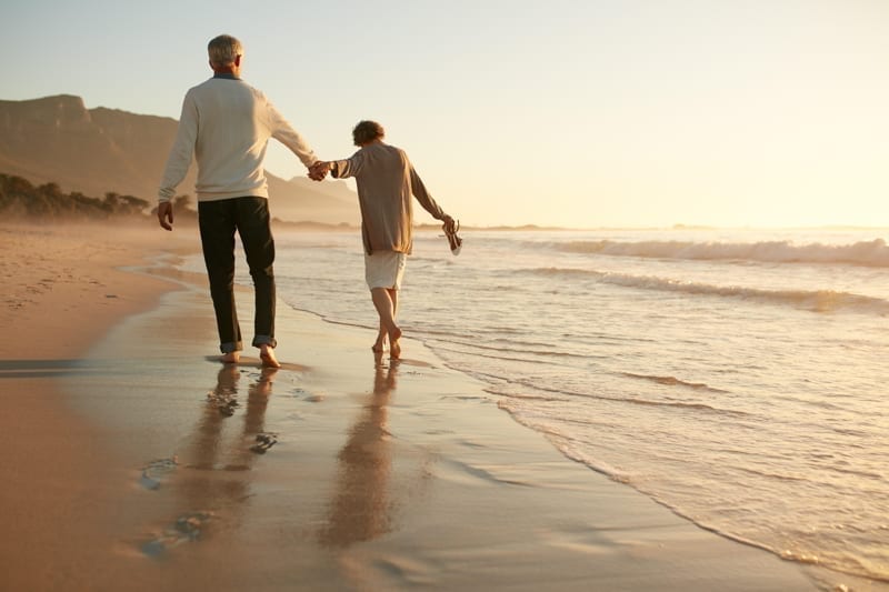 Senior couple having fun at beach.