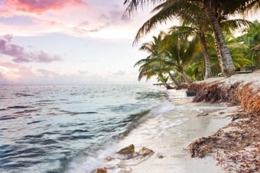 Beautiful tranquil beach sun rise in southern Belize.