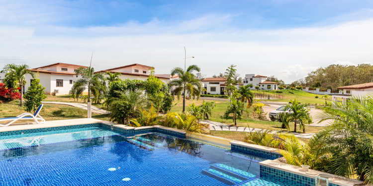 Swimming pool and the houses in the expat’s community project near Las Tablas in Panama.