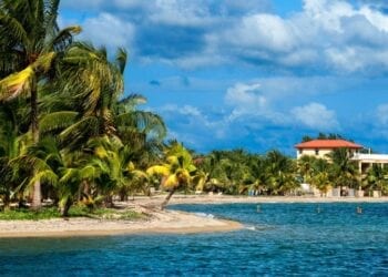 Cottages in front of the beach in Placencia, Belize.