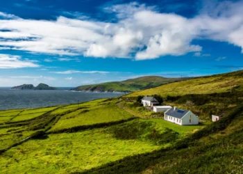 Clear blue skies, over green hills in Ireland.