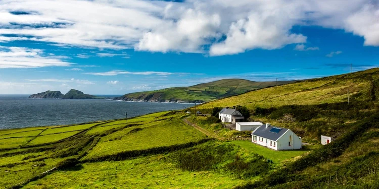 Clear blue skies, over green hills in Ireland.