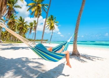 Woman relaxing on a hammock in Saona Island, Dominican Republic