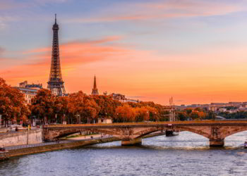 Sunset view of Eiffel tower and Seine river in Paris, France during autumn.