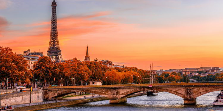 Sunset view of Eiffel tower and Seine river in Paris, France during autumn.