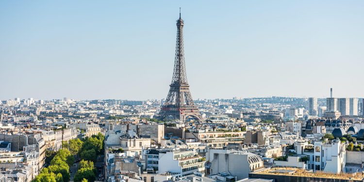 Aerial view of the old town of Paris, with the building of Eiffel tower, from the top of the Arc de Triomphe at the Champs-Elysees Avenue in Paris, France.