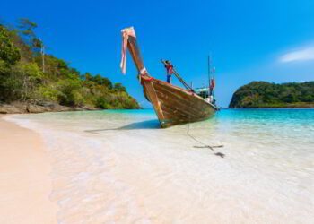 Long tail boat against blue sky and sea. Koh Rok island, Krabi, Thailand