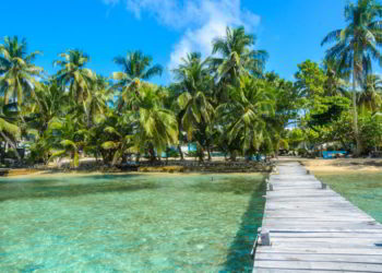 Small tropical island at Barrier Reef with paradise beach in Belize