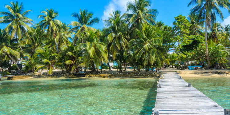 Small tropical island at Barrier Reef with paradise beach in Belize