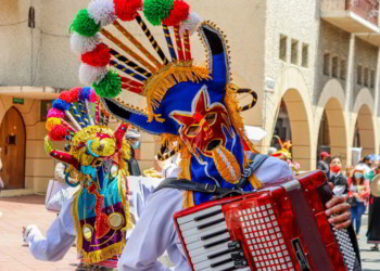 The Christmas parade Pase del Nino (Traveling Child) at historic center of city Cuenca