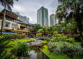 Gardens and skyscrapers at Greenbelt Park in the Philippines