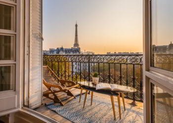 Beautiful Paris balcony at sunset with Eiffel Tower view