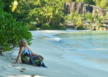 Portrait of happy elderly woman on beach