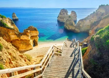 Wooden footbridge to beautiful beach Praia do Camilo near Lagos, Portugal