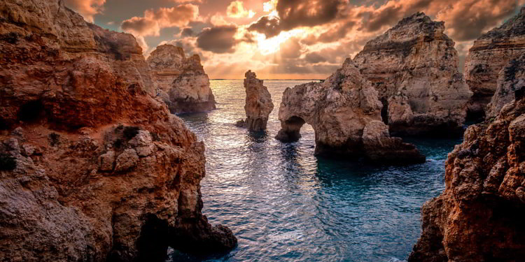 Sunset landscape on Atlantic Ocean, south Portugal best countries to live