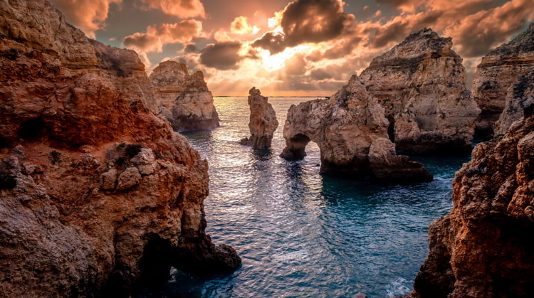 Sunset landscape on Atlantic Ocean, south Portugal best countries to live