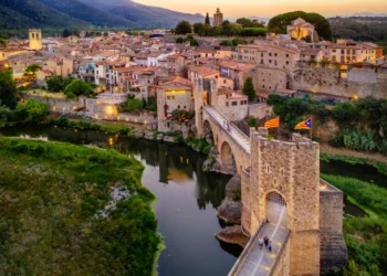 View Of The Medieval Bridge Of The Besalu, Catalonia, Spain. good life