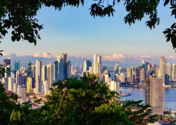 View of Panama City's skyline framed by a tropical rainforest.