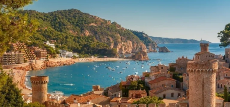 Aerial view of Fortress Vila Vella and Badia de Tossa bay at summer in Tossa de Mar on Costa Brava, Catalunya, Spain. low humidity overseas