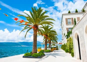 Blue skies as backdrop for a sea promenade in Tivat, Montenegro. Kotor bay