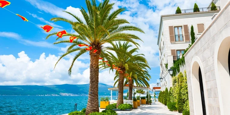 Blue skies as backdrop for a sea promenade in Tivat, Montenegro. Kotor bay