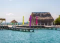 Small tropical island at Barrier Reef with paradise beach, known for diving, snorkeling and relaxing in the beach. Caribbean Sea, Belize, Central America.