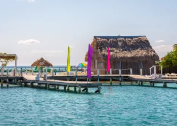 Small tropical island at Barrier Reef with paradise beach, known for diving, snorkeling and relaxing in the beach. Caribbean Sea, Belize, Central America.