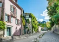 Cozy tourist alley in Paris, Monmartre street, France