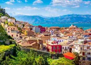 Nafplio, Greece aerial view and snow mountains.