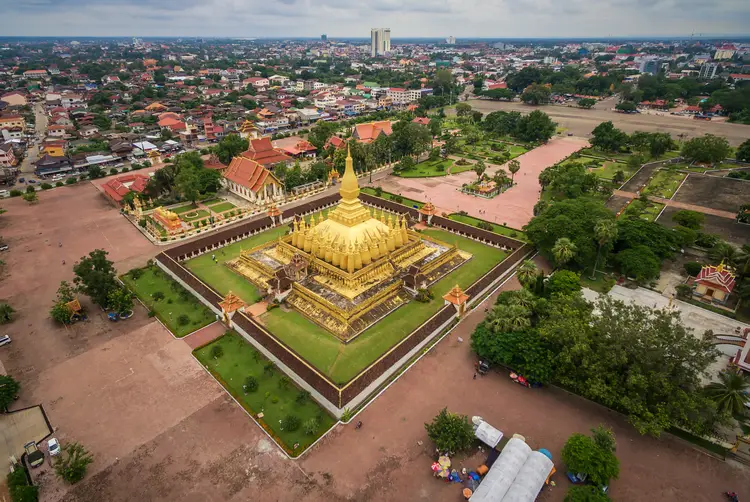 Aerial view of a golden pagoda in Wat Phra That Luang, Vientiane Laos