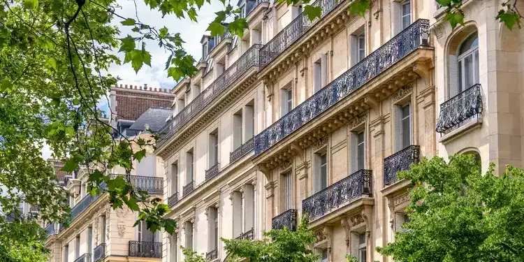 Residential building along a street in Paris, France. overseas rentals