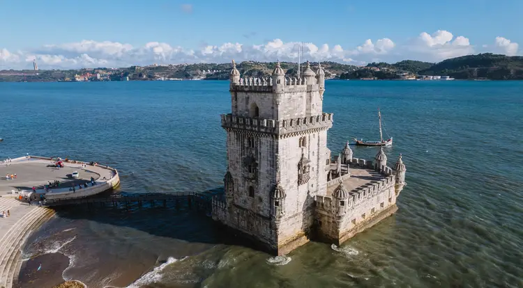 Belem Tower "Torre de Belém". Fortress monument in Lisbon on the Tagus River. map of portugal