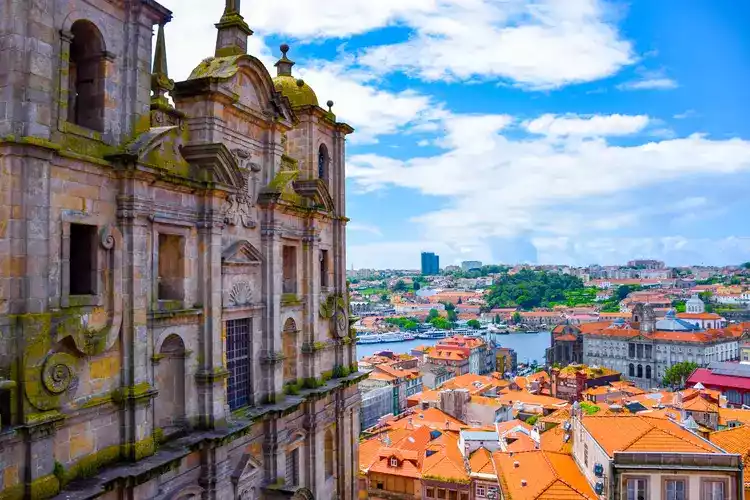 View of colorful Porto's city center with Duoro river from Igreja dos Grilos. travel in portugal