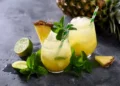 Cold pineapple drink with crushed ice, lime and mint. Happy Hour