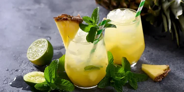 Cold pineapple drink with crushed ice, lime and mint. Happy Hour